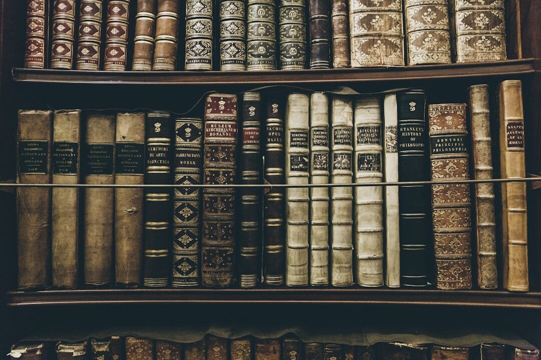 Antique bookshelf filled with old hardcover detective novels and a magnifying glass